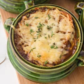 Learn how to make perfect French Onion Soup in the Instant Pot. Cozy, hearty and flavorful onion soup is topped with melted cheese and a crusty sourdough crouton in this easy recipe!