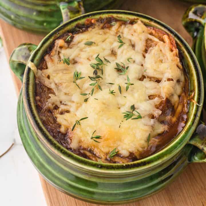 Learn how to make perfect French Onion Soup in the Instant Pot. Cozy, hearty and flavorful onion soup is topped with melted cheese and a crusty sourdough crouton in this easy recipe!