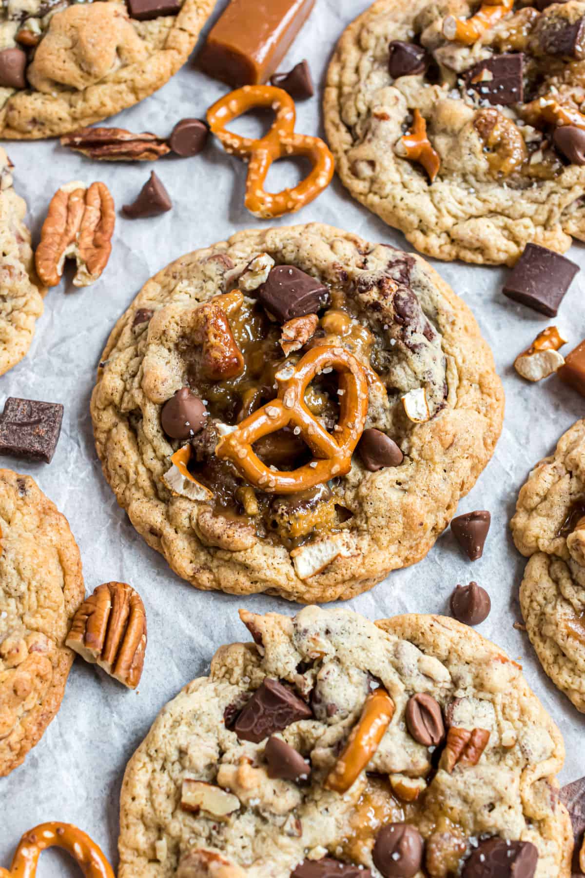 Cookies topped with pretzels, chocolate, and pecans.