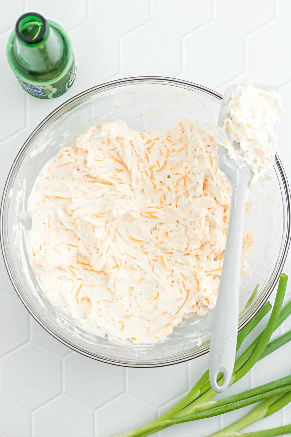 Beer cheese dip in a mixing bowl.