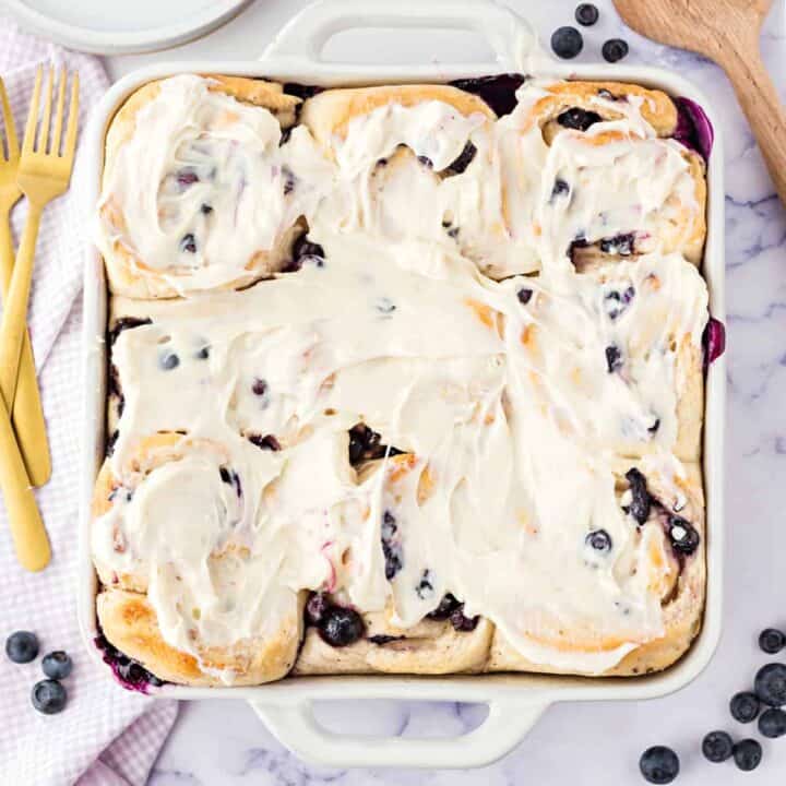 These soft Blueberry Sweet Rolls have a sugared blueberry filling and a delicious cream cheese frosting for a sweet breakfast treat that will be the highlight of your morning!