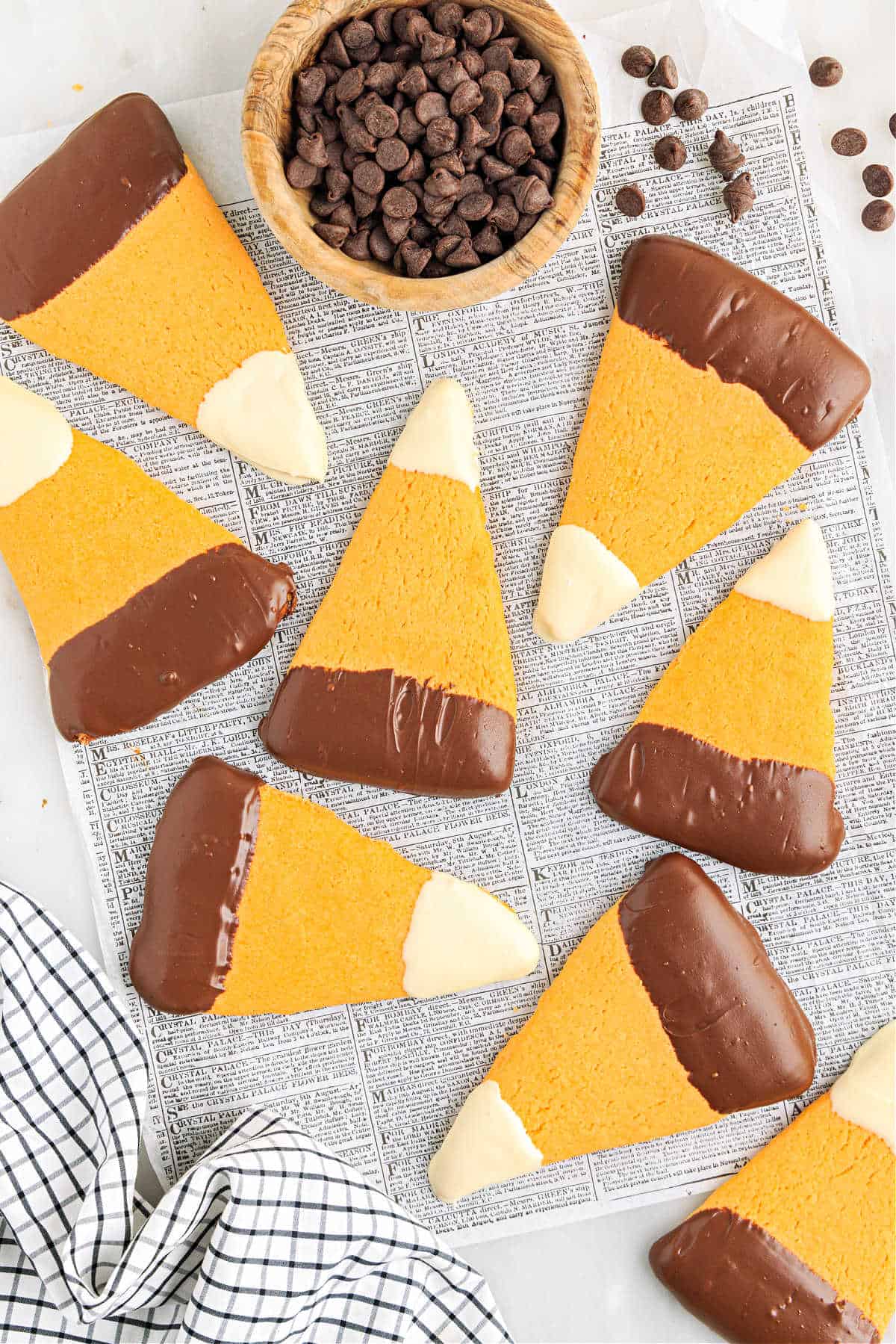Candy corn shaped sugar cookies with chocolate.
