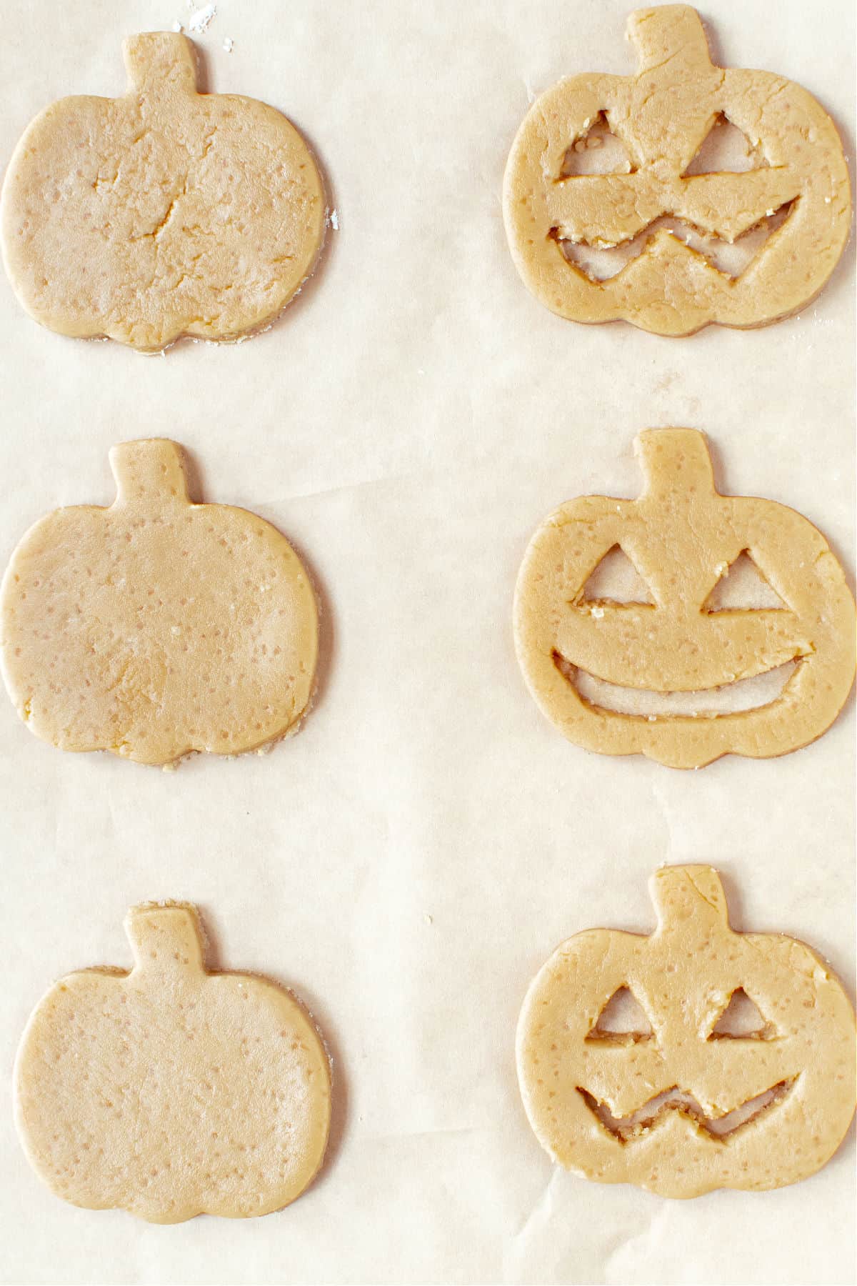 Cut out cookies shaped like pumpkin faces before baking.