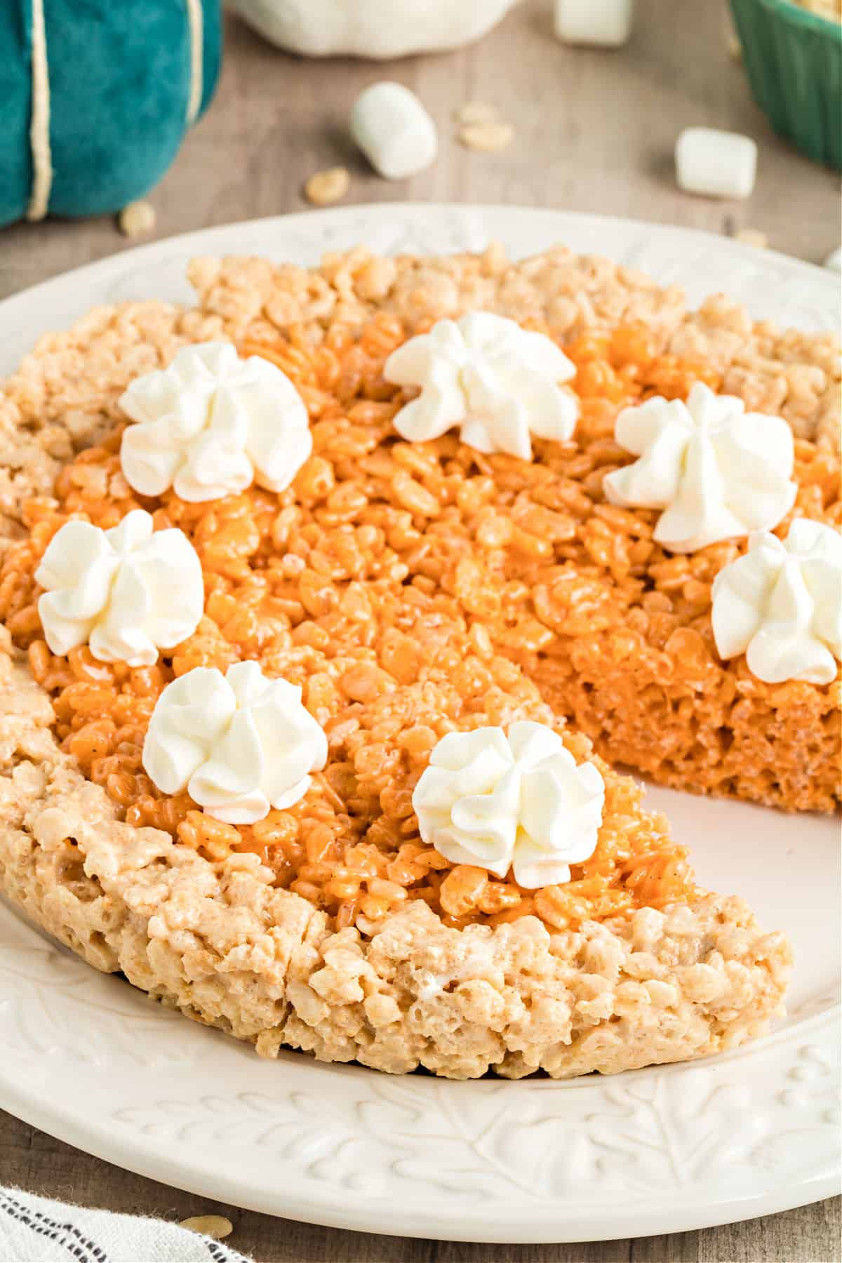 Pumpkin pie rice krispie treats with a slice removed.