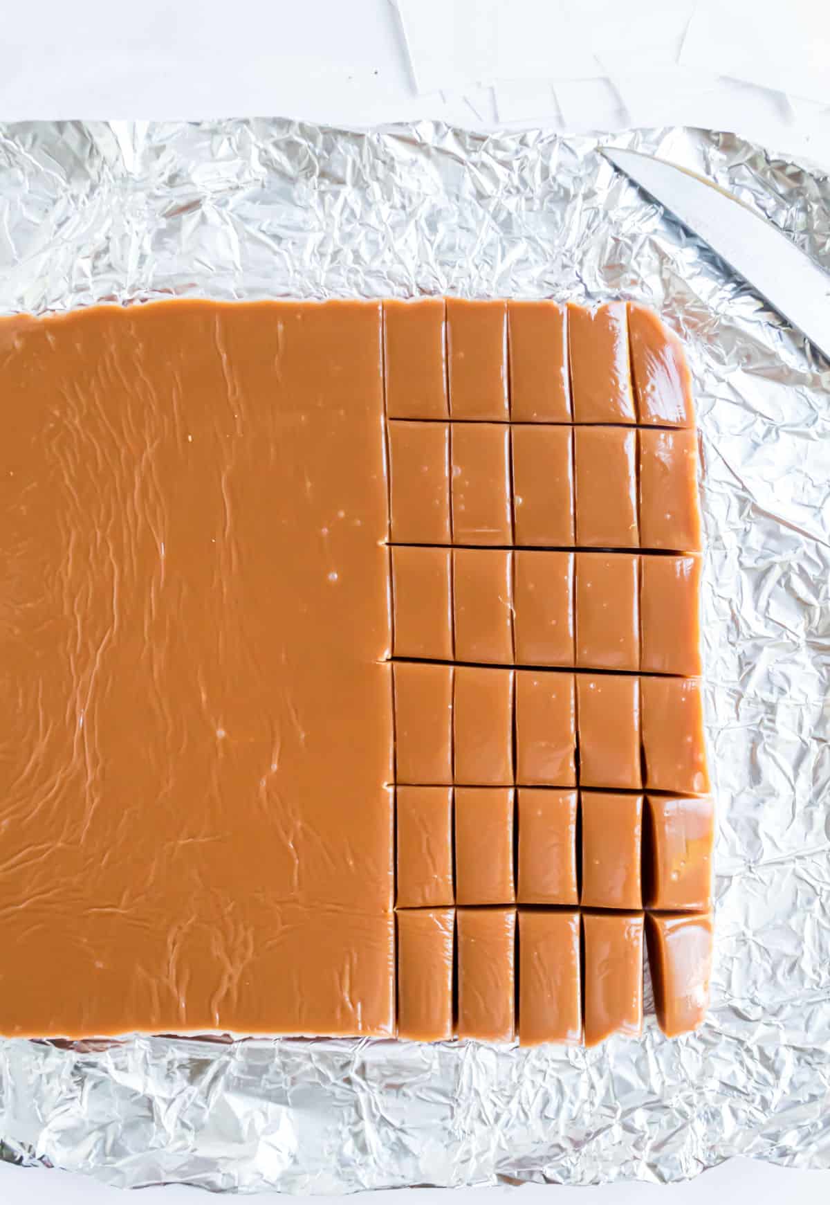 Sliced caramels on foil.