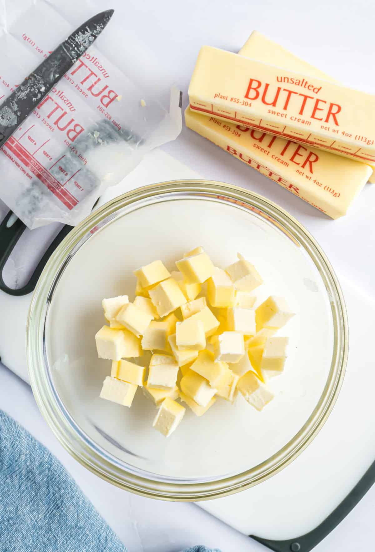 Butter cut into small cubes to soften in a glass bowl.