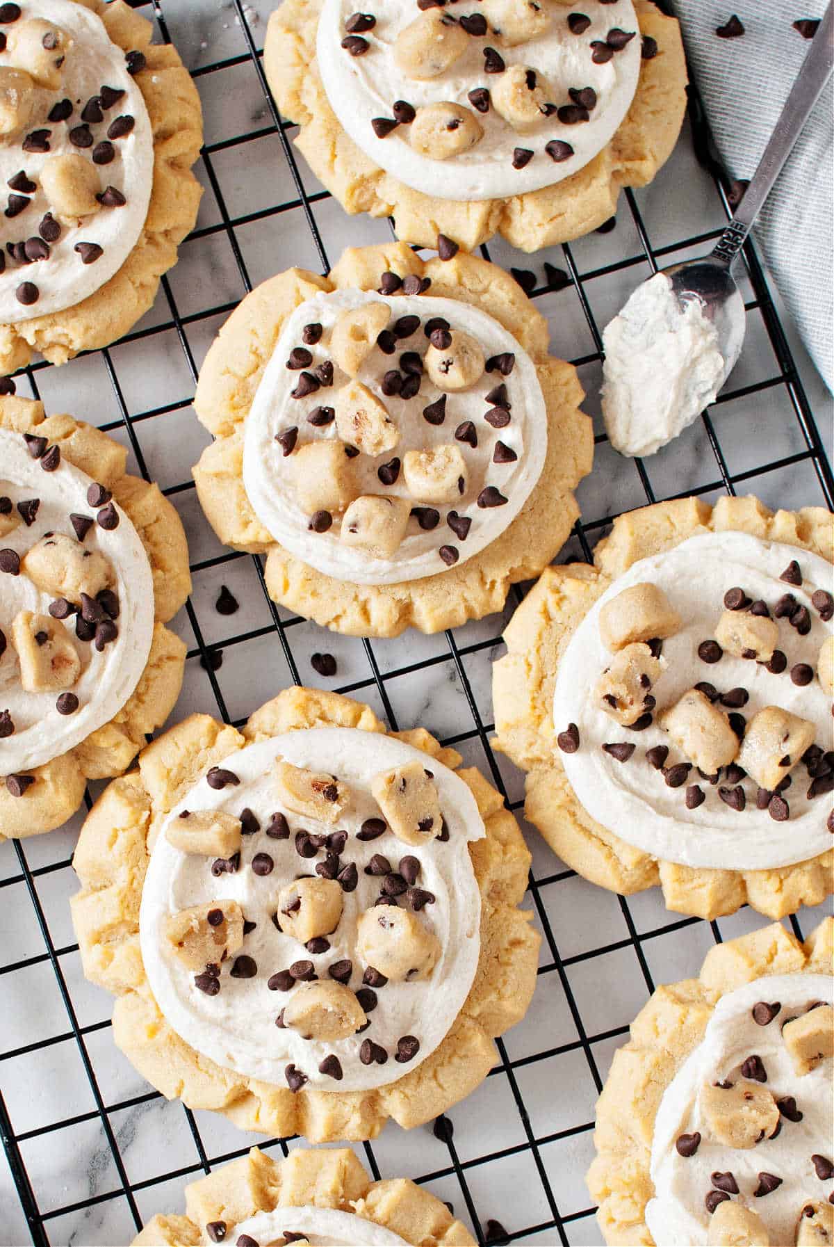 Cookies with cookie dough topping on a wire cooling rack.