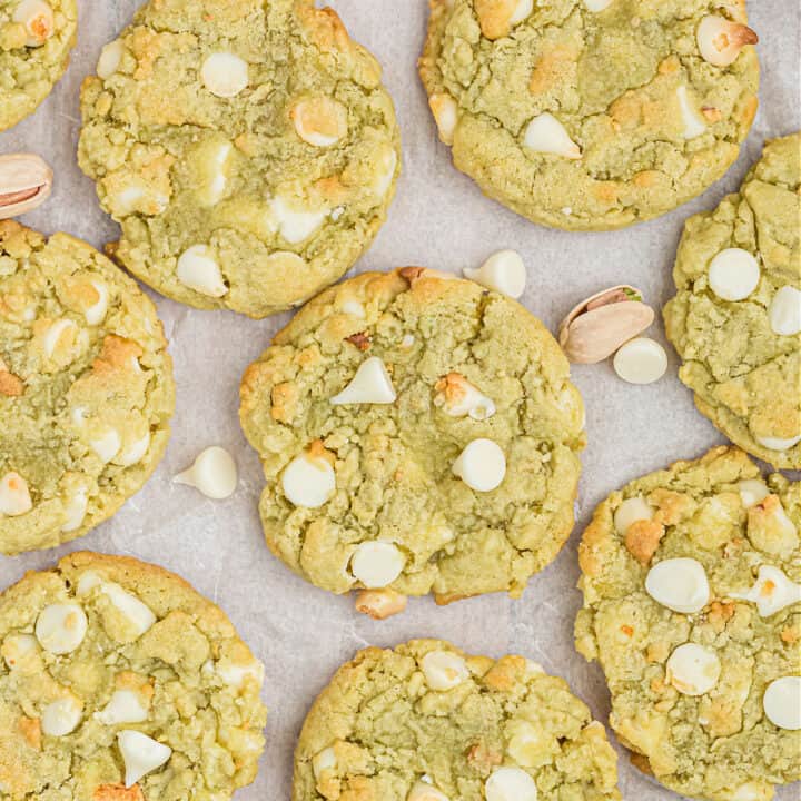 Pistachio Cookies are made with a pistachio pudding mix for a super soft and pretty cookie that's studded with loads of white chocolate chips. These easy cookies are always a hit!
