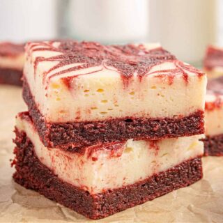 Red Velvet Cheesecake Brownies take the decadent fudgy brownie we love and elevates it to new heights. A layer of soft and creamy cheesecake swirled with ultra chocolatey red velvet brownie batter