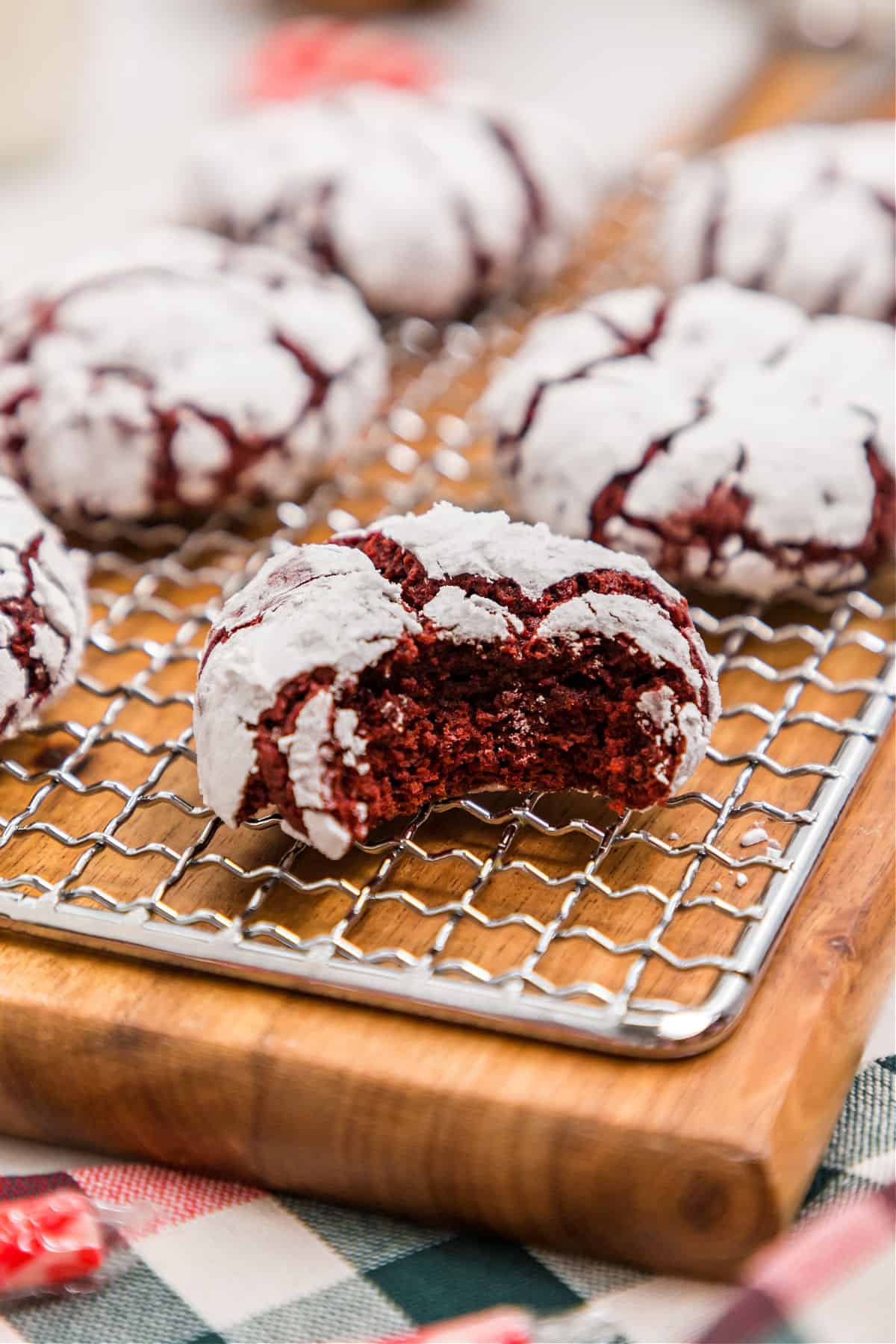 Red velvet cookies with a bite taken out.