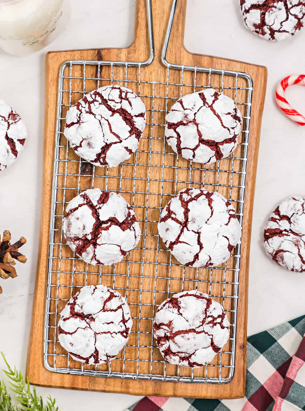 Red velvet cookies on a wire cooling rack.