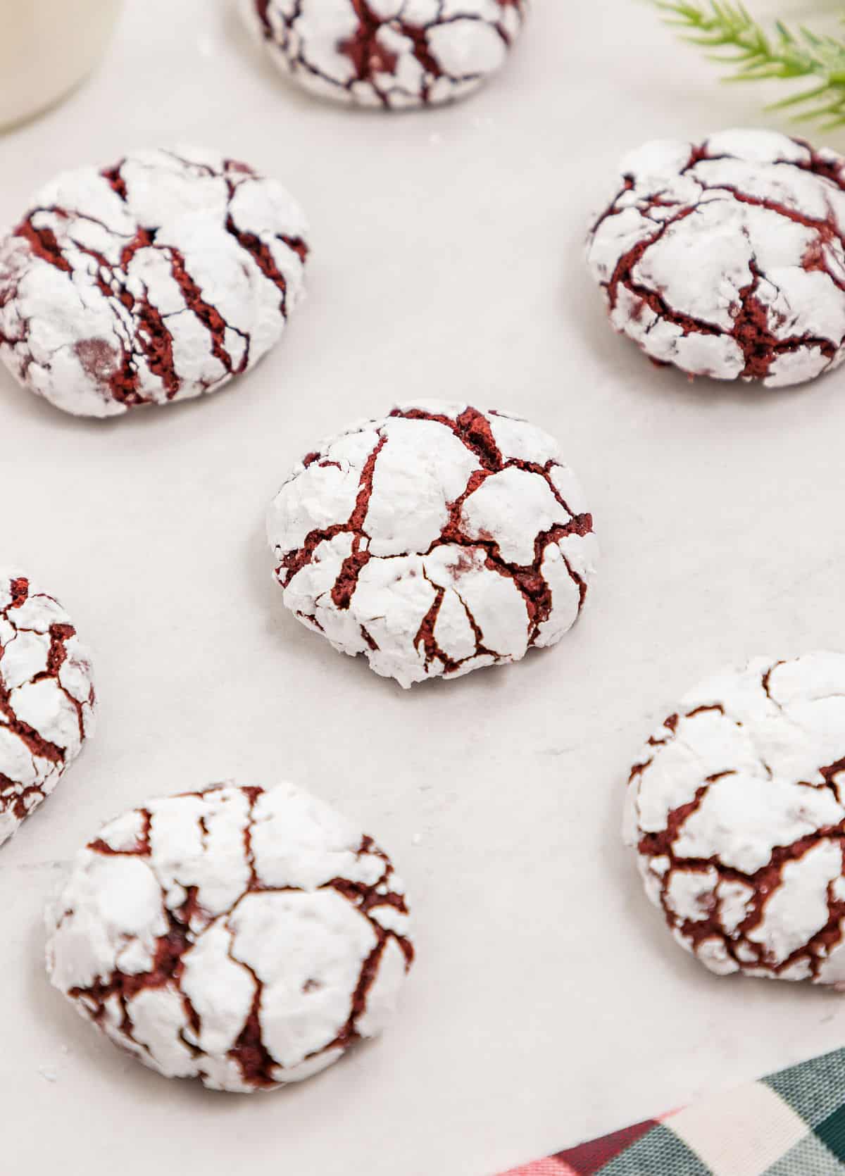 Red velvet cookies rolled on powdered sugar and baked.