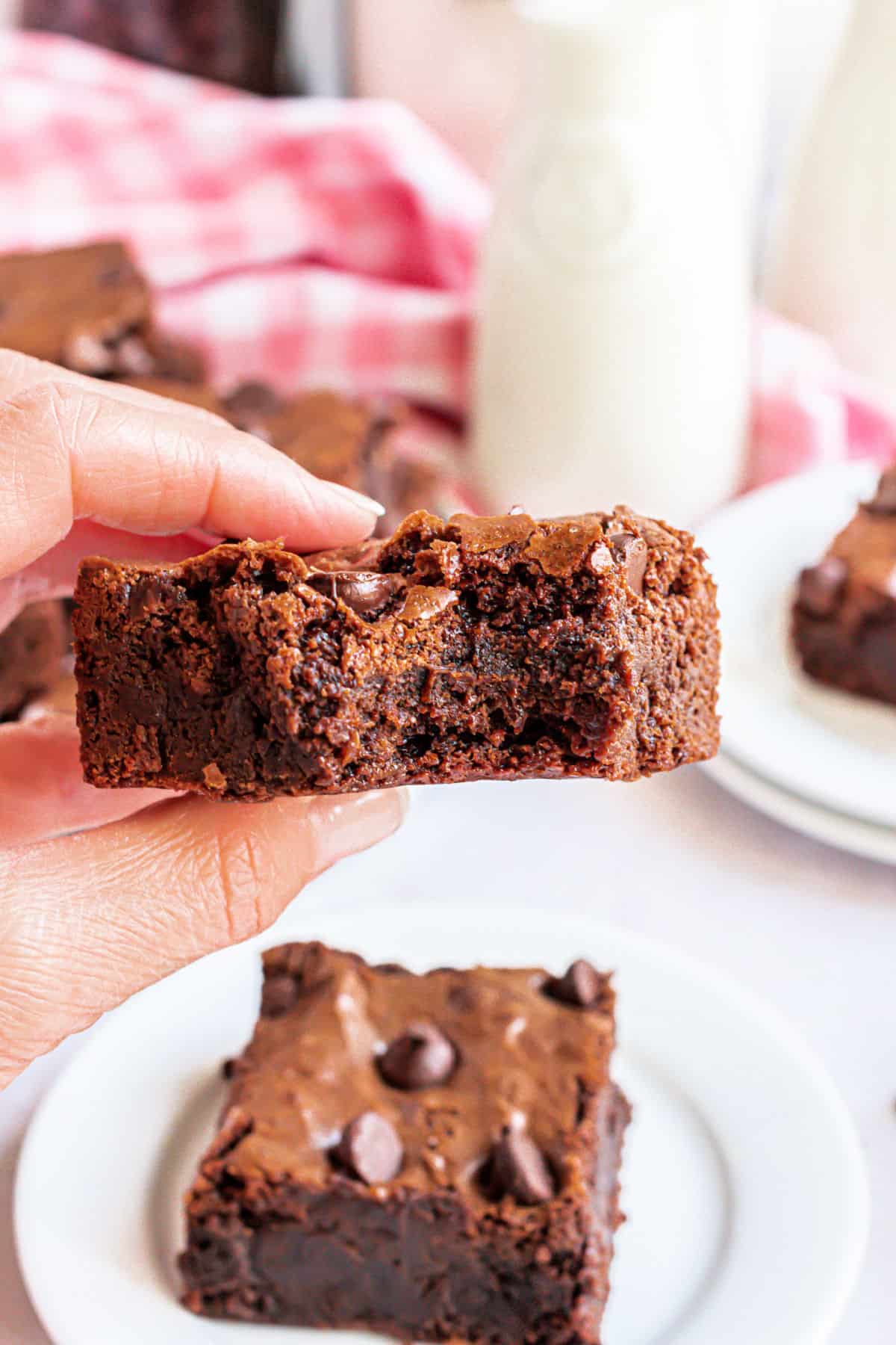 Bite taken out of thick brownie.