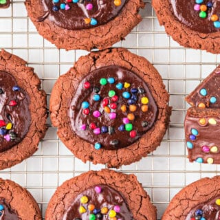 Cosmic Brownie Cookies have a soft, chewy chocolate cookie base that's topped with melted chocolate and sprinkled with colorful chocolate candies for a fun dessert! They are out of this world delicious!
