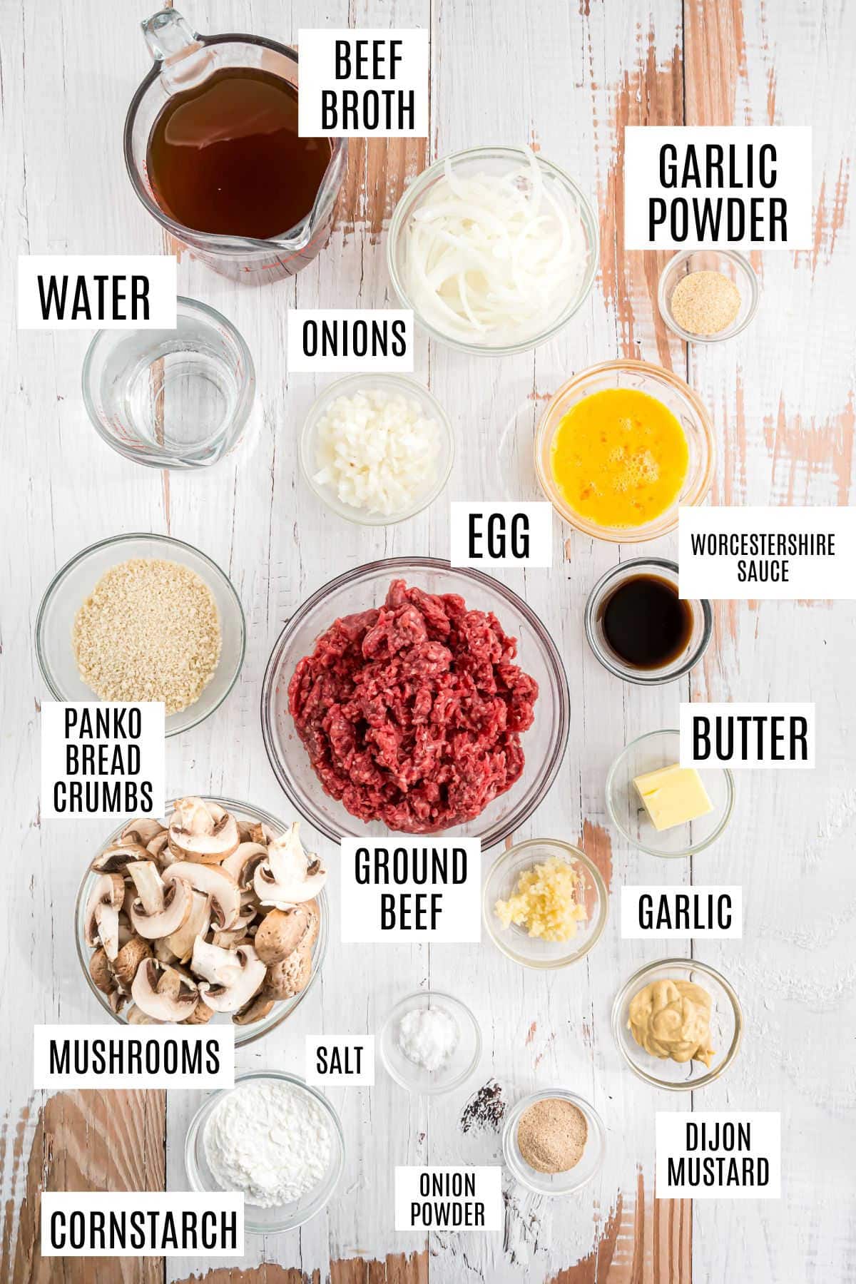 Ingredients for instant pot salisbury steak arranged in bowls on a white surface, each item labeled with text.