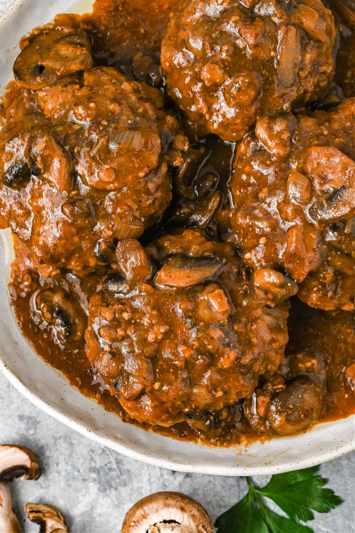 Salisbury steak and gravy served in a large white bowl.