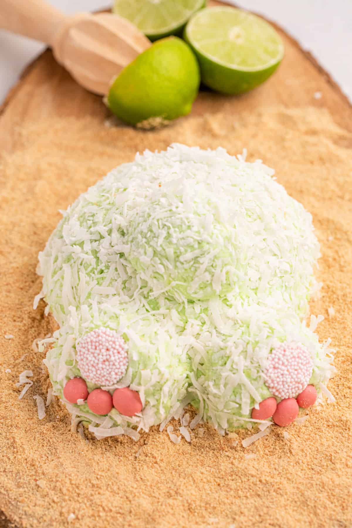 Bunny butt cheese ball served on a graham cracker crumb coated board.