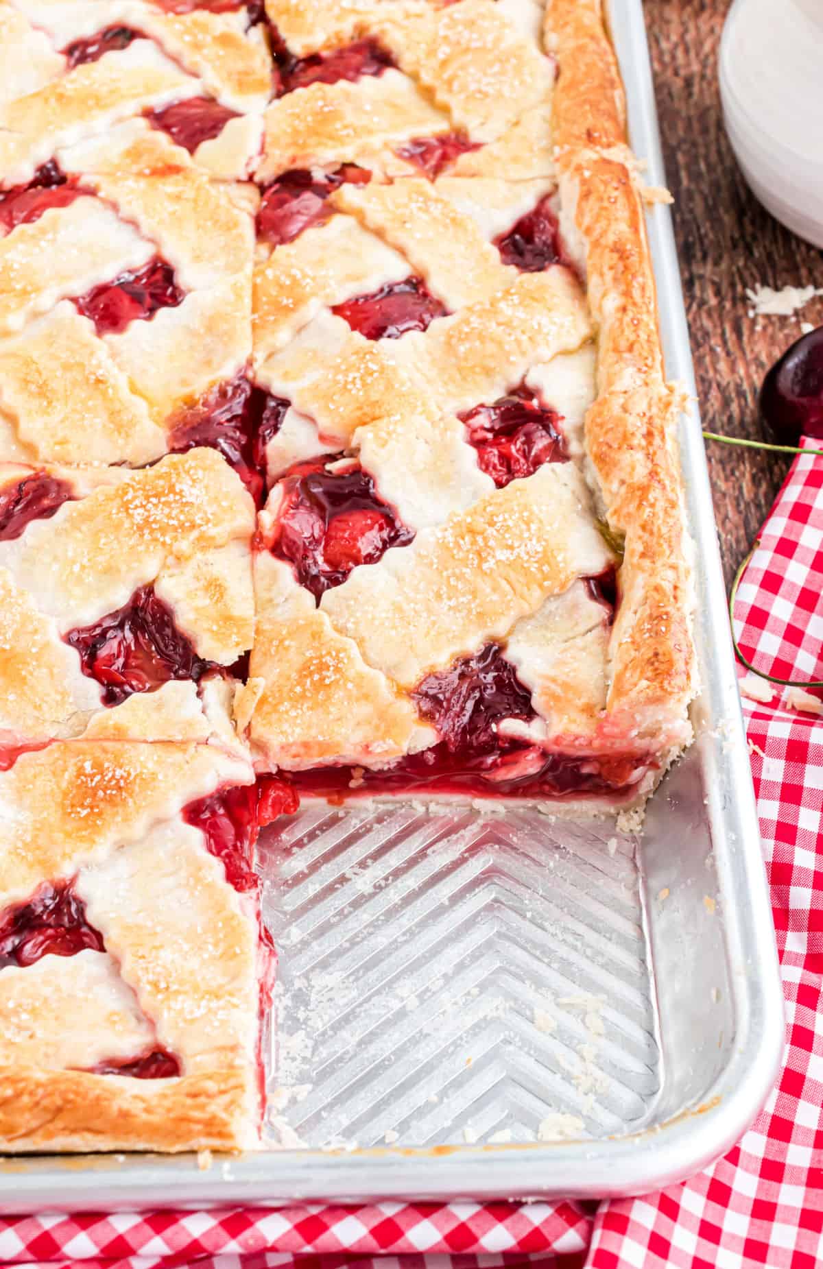 Cherry pie in a sheet pan with a lattice topping.
