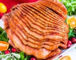 This Honey Baked Ham is juicy, tender, and perfectly caramelized. It’s easy to make, and has a mouthwatering honey brown sugar glaze. If you’re looking for a holiday meal, look no further.