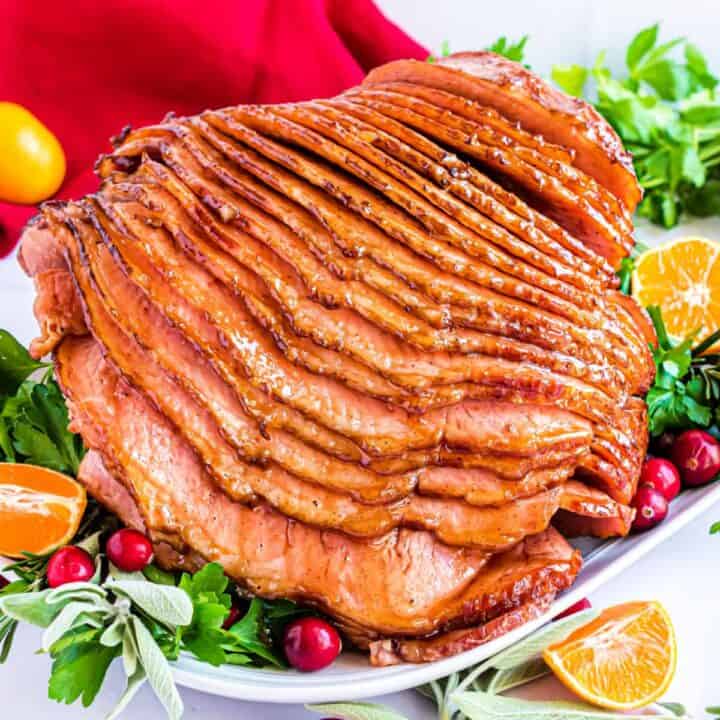 This Honey Baked Ham is juicy, tender, and perfectly caramelized. It’s easy to make, and has a mouthwatering honey brown sugar glaze. If you’re looking for a holiday meal, look no further.