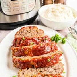 This down-home and cozy Instant Pot Meatloaf recipe is melt-in-your-mouth good and topped with an irresistible tangy and sweet glaze. But above all, it’s a delicious comfort recipe that you can turn to any night of the week.