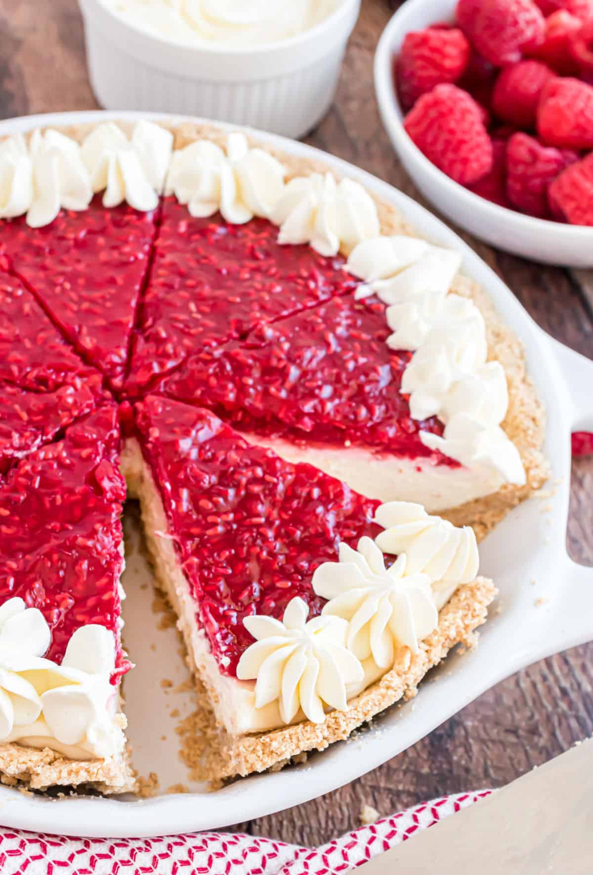 Cheesecake with raspberry glaze and fresh whipped cream.