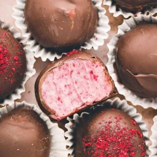 These Raspberry Truffles have a creamy, gorgeous center and a crunchy dark chocolate shell for a delicious - and no-bake - dessert that's sure to impress!