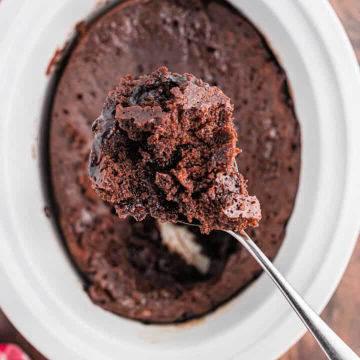 This Slow Cooker Hot Fudge Cake is warm, gooey and full of rich chocolate flavor! Plus, it's just 6 ingredients and only takes 5 minutes to prep (and no one will know it starts with a cake mix)!