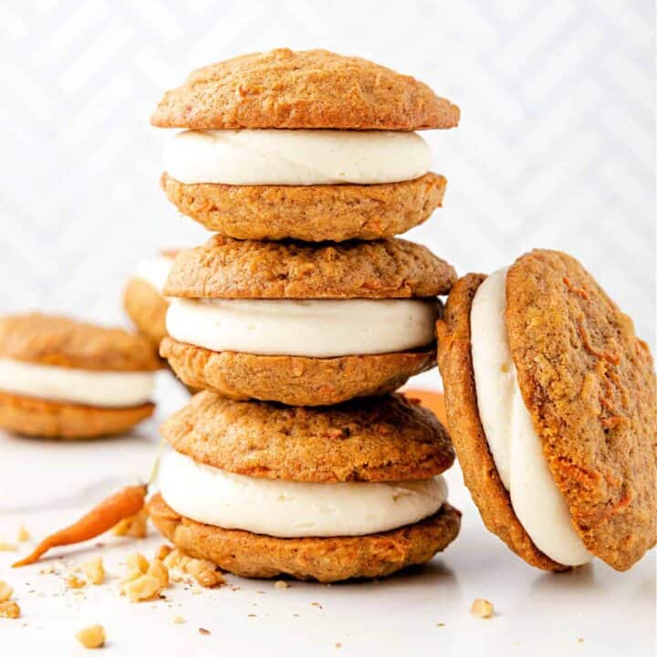 Carrot Cake Whoopie Pies are like portable carrot cakes with cream cheese icing. These soft and cakey cookies are made with shredded carrots, walnuts, and spices. Ready in about 30 minutes, they’ll be your new favorite grab-and-go treat. 