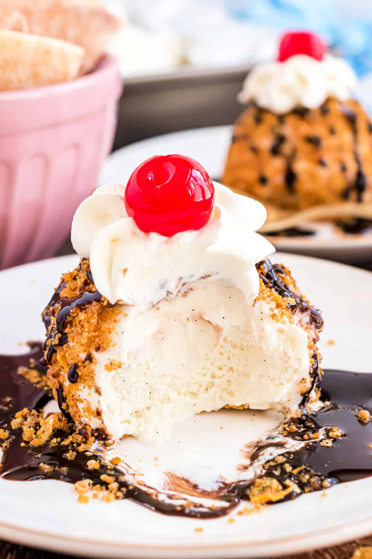 Homemade fried ice cream with a bite taken out.