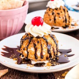 This no-fry Fried Ice Cream delivers the classic Fried Ice Cream flavor without the fuss and mess. This recipe is convenient and delicious, with the crunchy cornflake topping and creamy vanilla ice cream center!