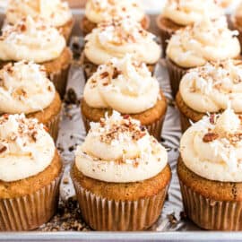 Hummingbird cupcakes on a metal cookie sheet.