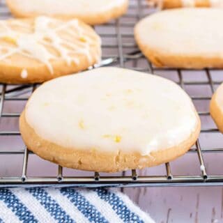 Lemon iced cookies on a wire rack.