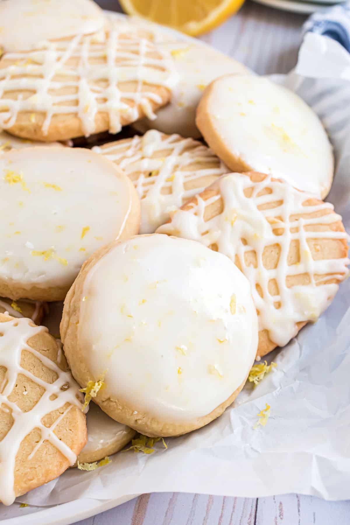 Lemon shortbread cookies with lemon icing in a basket.