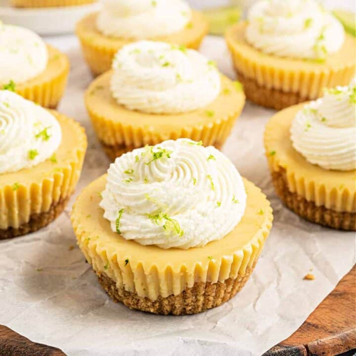 These cute little Mini Key Lime Pies come together easily with just a handful of ingredients and are the perfect individual dessert! These zesty little bites are packed with key lime flavor and have an easy, homemade graham cracker crust.