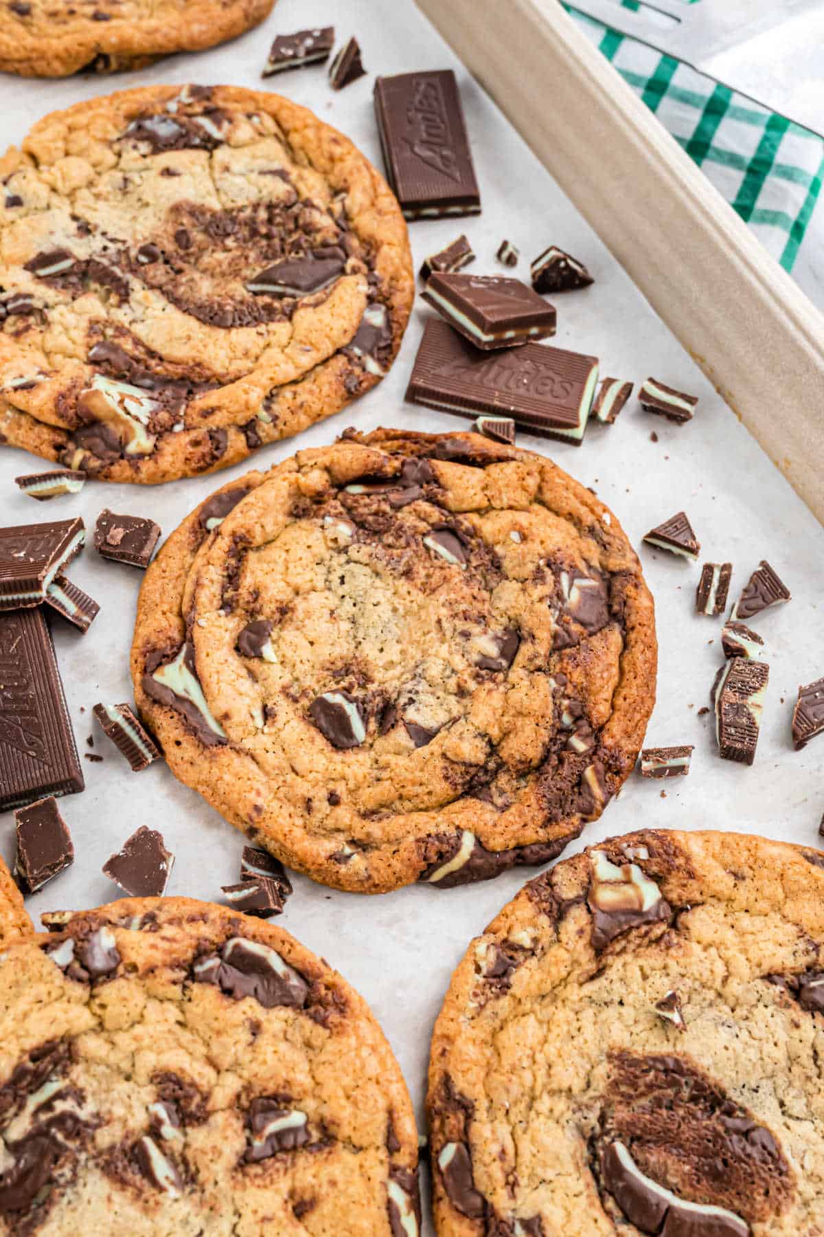 Andes mint chocolate cookies on a baking sheet with parchment paper.