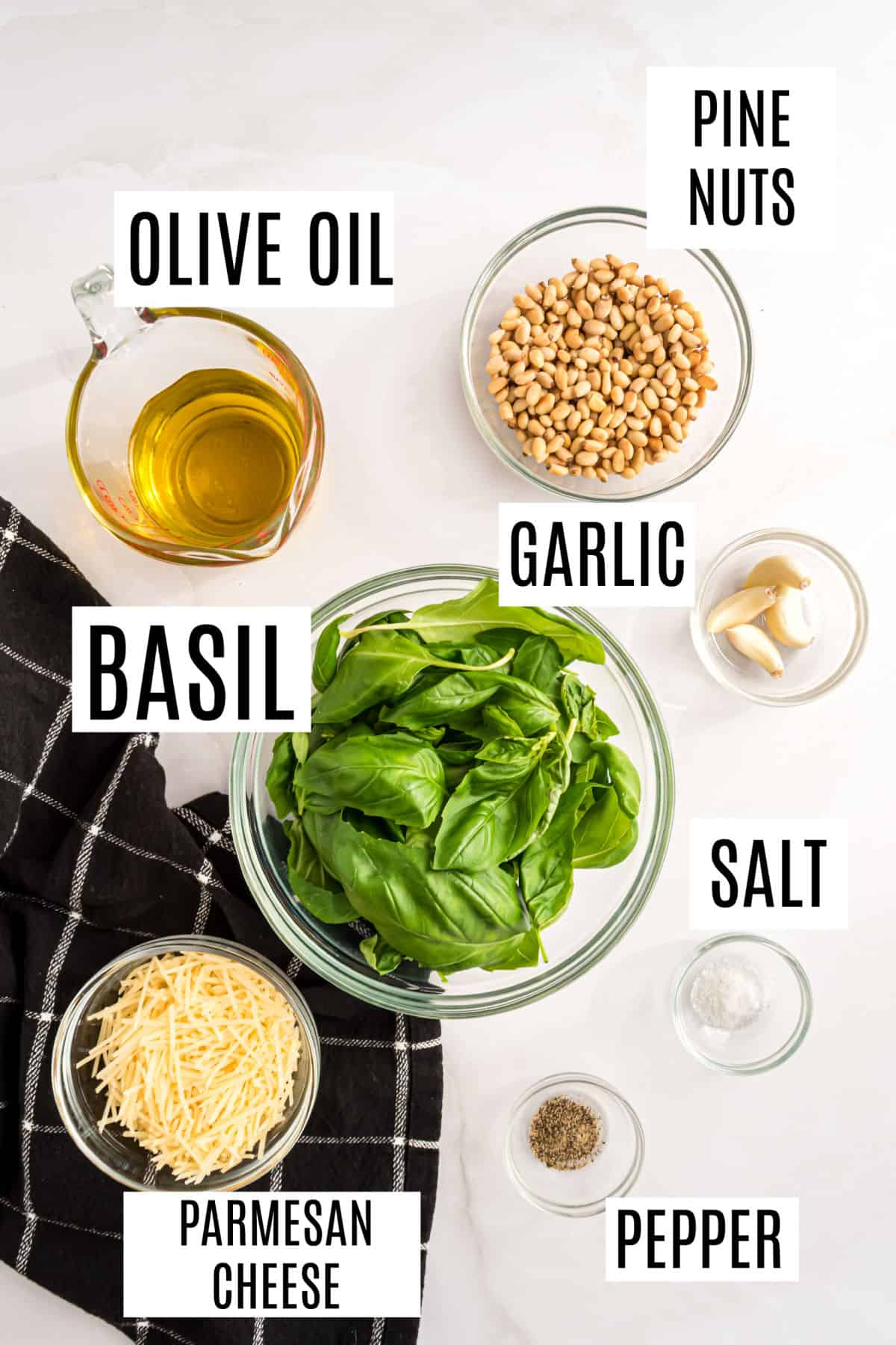 Ingredients needed to make basil pesto.