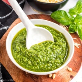 This quick and easy Basil Pesto is so delicious, you'll need to make a second batch! Perfect for adding to pasta, fish, baked tomatoes and sandwiches, it's kicks up the flavor of your favorite foods!