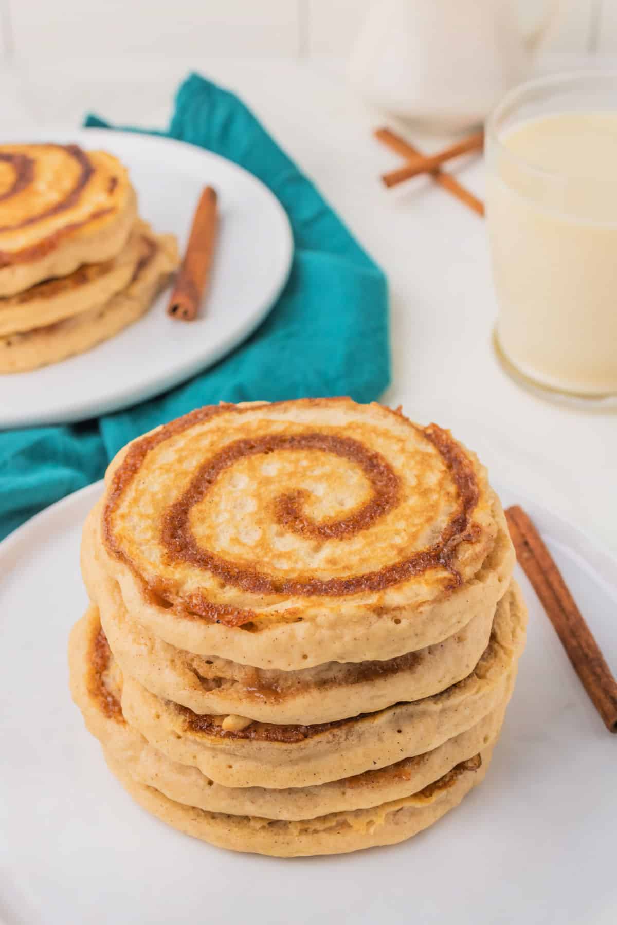 Stack of cinnamon roll pancakes without syrup.