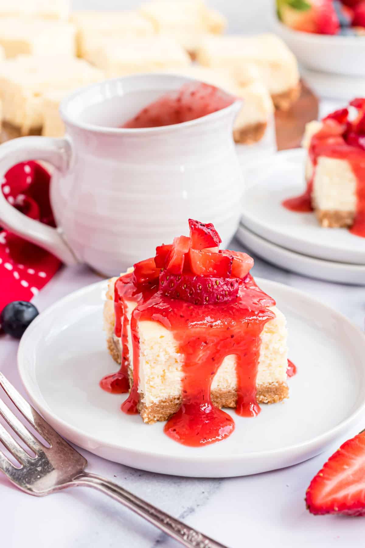 Cheesecake bar topped with strawberry syrup.