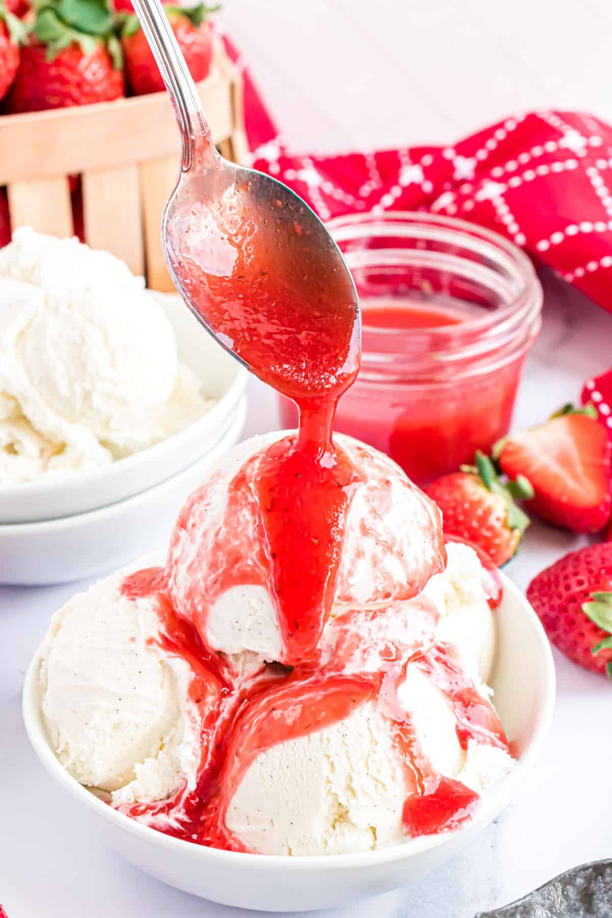 Vanilla ice cream topped with strawberry syrup.