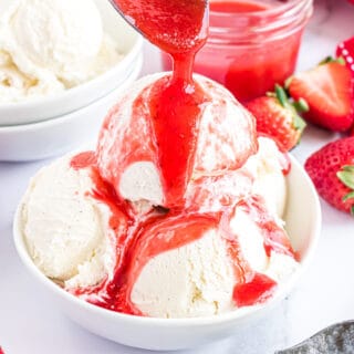 Vanilla ice cream topped with strawberry syrup.