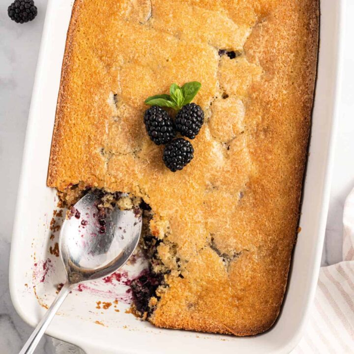 Homemade Blackberry Cobbler has a buttery, golden brown biscuit crust, a deliciously moist interior, and is bursting with fresh blackberries. Better still, it’s easy to make and only requires 15 minutes of prep time.
