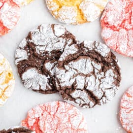 Cool whip crinkle cookies on parchment paper.