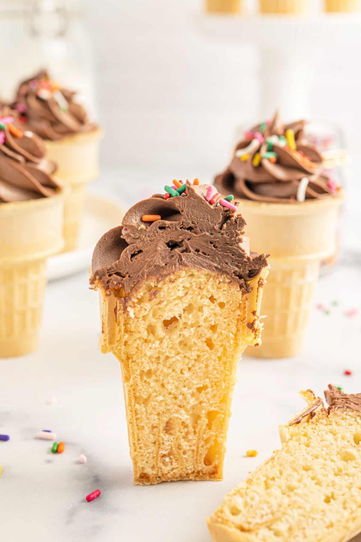 Ice cream cone cupcake cut in half to reveal the inside.