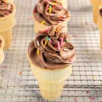 Ice cream, cone cupcake on a wire cooling rack.