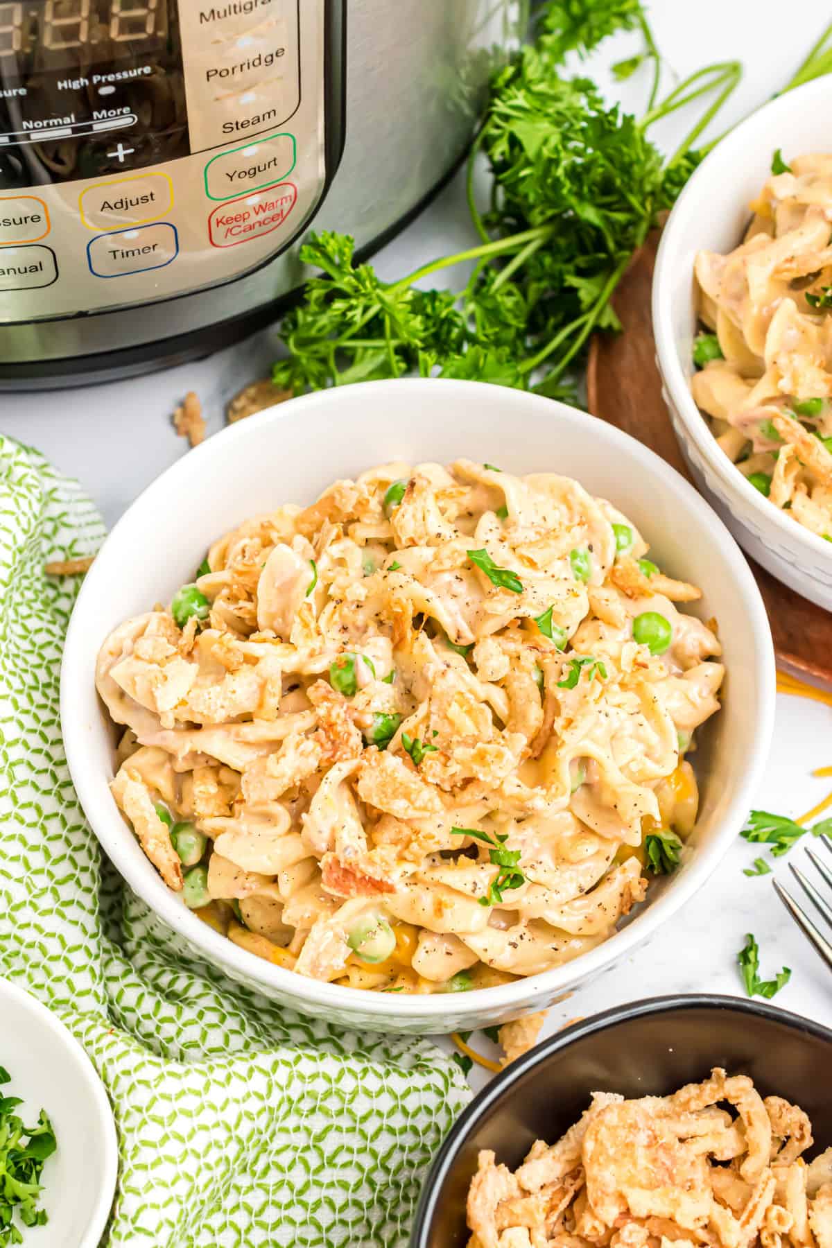 Tuna casserole served in a white dinner bowl.