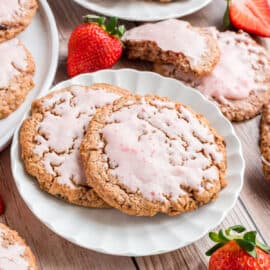 Strawberry Cookies are soft-baked cookies loaded with wholesome oats and dried strawberries. Topped with a sweet strawberry icing, these are not only beautiful, but delicious too!