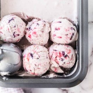 My easy Berry Ice Cream recipe has a decadent vanilla base complemented by the bright and fresh flavor of berries. It's quick to make and requires only 5 ingredients, with no fancy equipment needed.