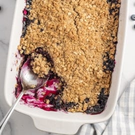 My homemade Blueberry Crisp has a juicy blueberry filling with a crisp and buttery oat topping. It’s absolutely delicious and likely to become one of your summertime favorites.